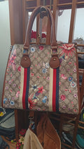 Borsa fiorata in cuoio